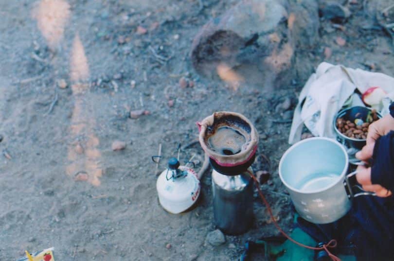 a picture of a man brewing coffee in the morning_files