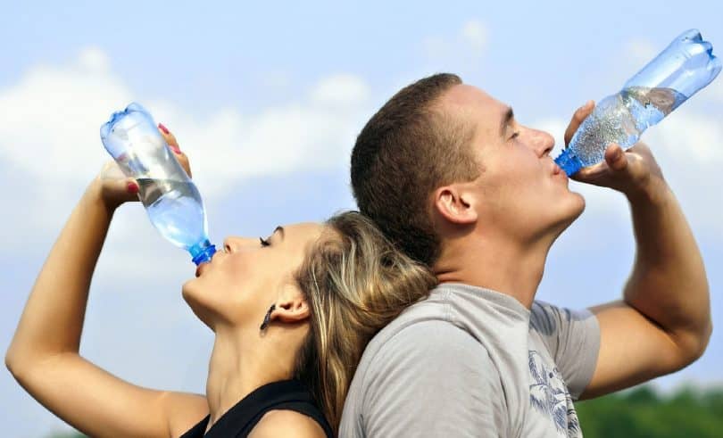 two adults drinking-water-filter
