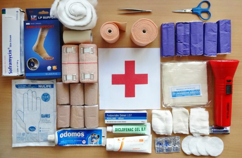 A first aid treatment kit on the table