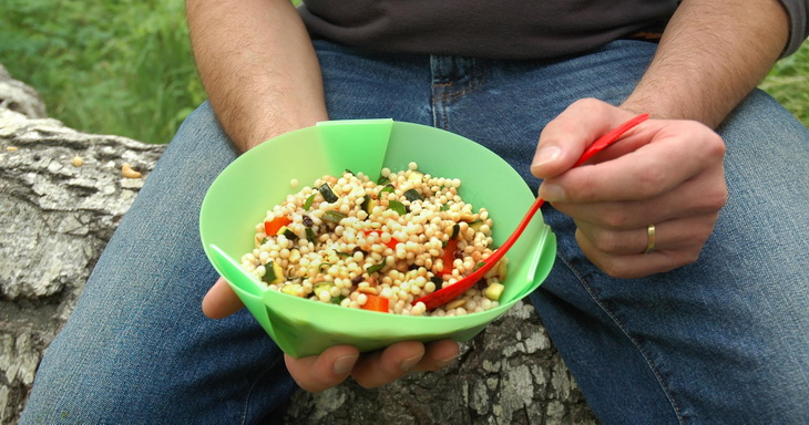 Picture of and Adult Eating Campfire Couscous Salad