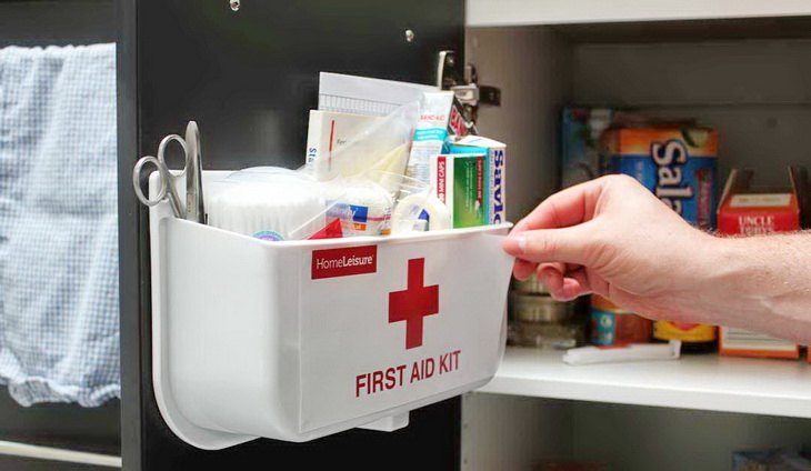 Man Working with a Home First Aid Kit