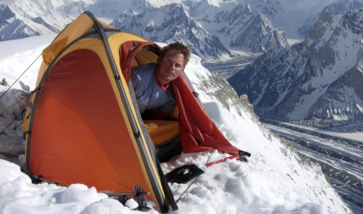 Man in a Polaris mountaineering tent