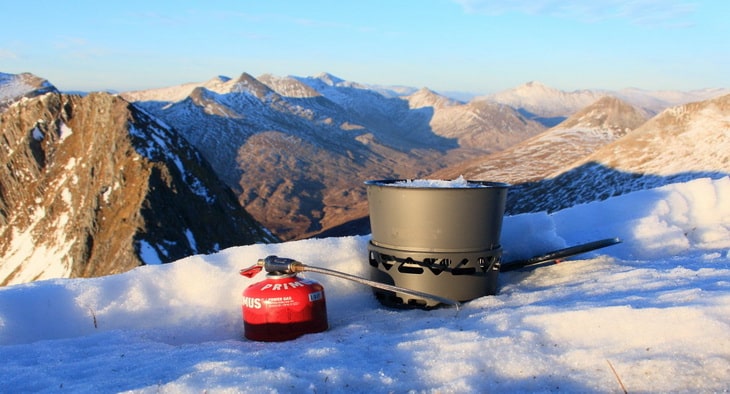 Melting snow for a brew with the Prime Tech stove and heat exchanger pot
