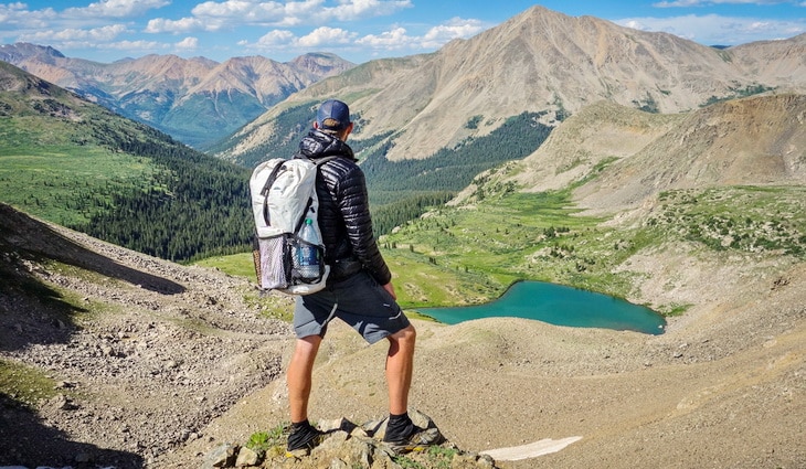 Man with a DIY backpack watching the landscape