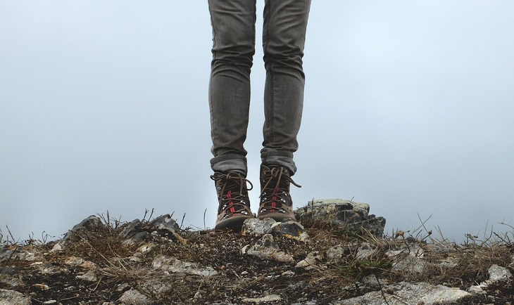 A woman hiking in skinny jeans
