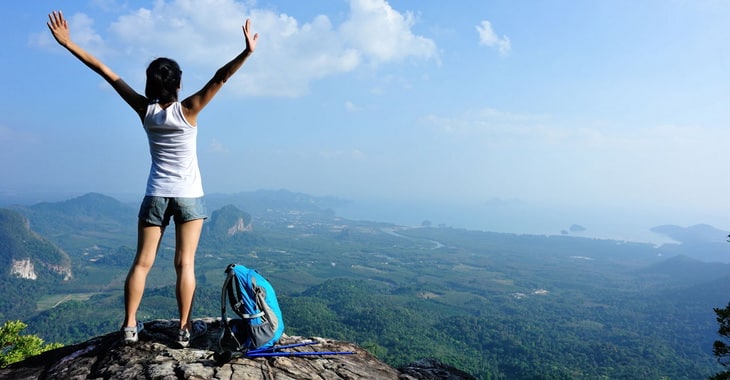 happy woman on the-top-of-mountains
