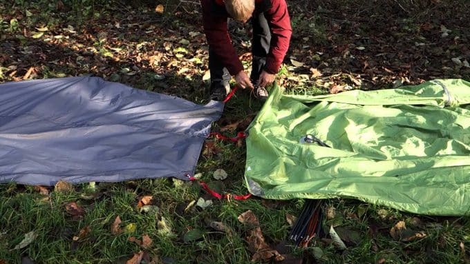 man-put-tent-and-footprint