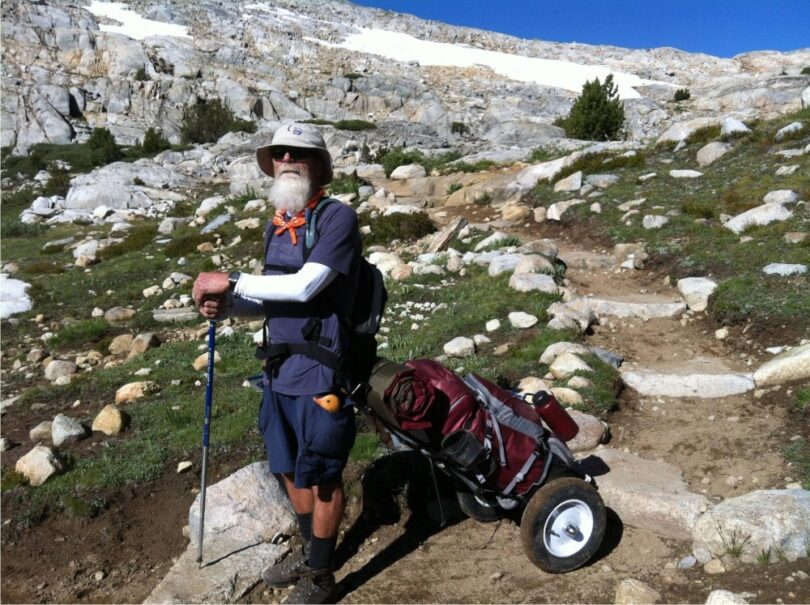 old-man-with-backpacking-cart