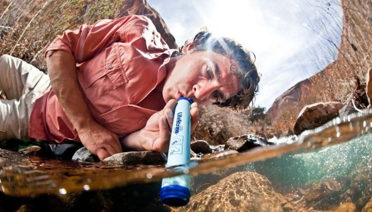 A man using a water filter
