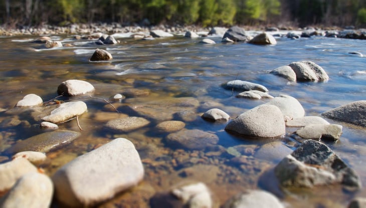 summer-rocks-near a river