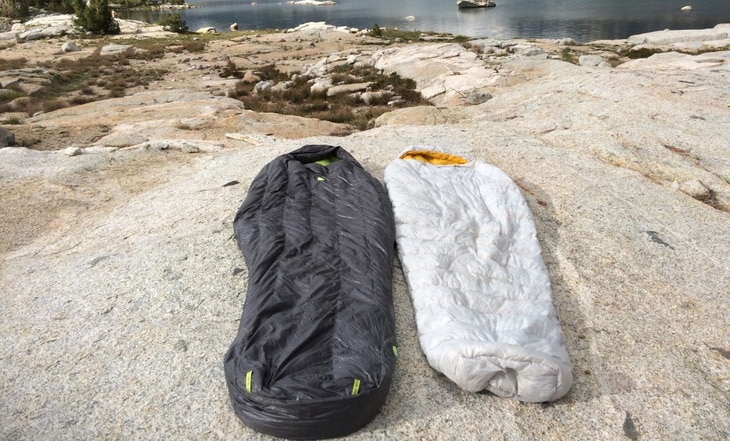 Globe Semi-Rectangular Sleeping Bags on the ground outside