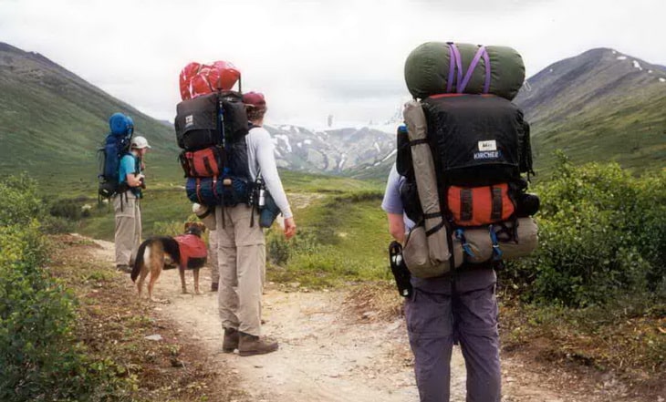 Hikers with external frame backpacks