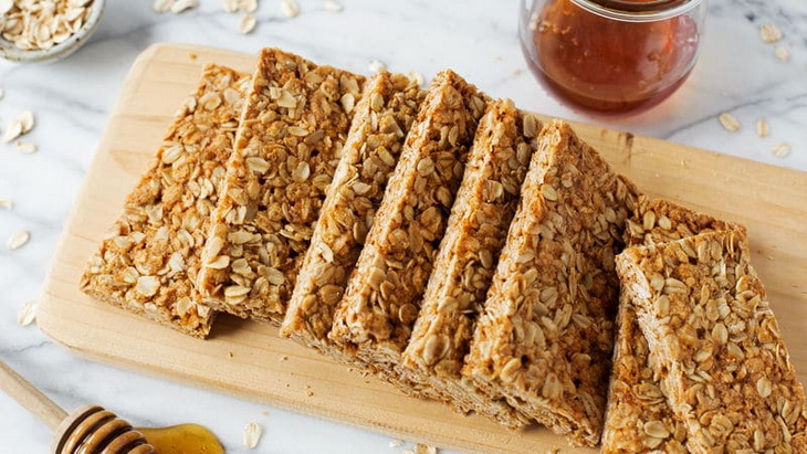 Energy bars on wooden cutting board