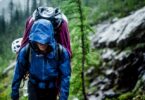 Woman hiking in the forest on a rainy day