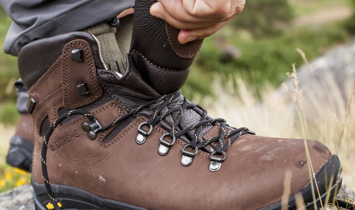 Image of a person checking the hiking boots
