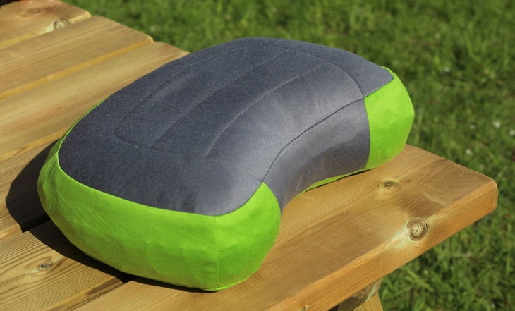 A pillow on a wooden table