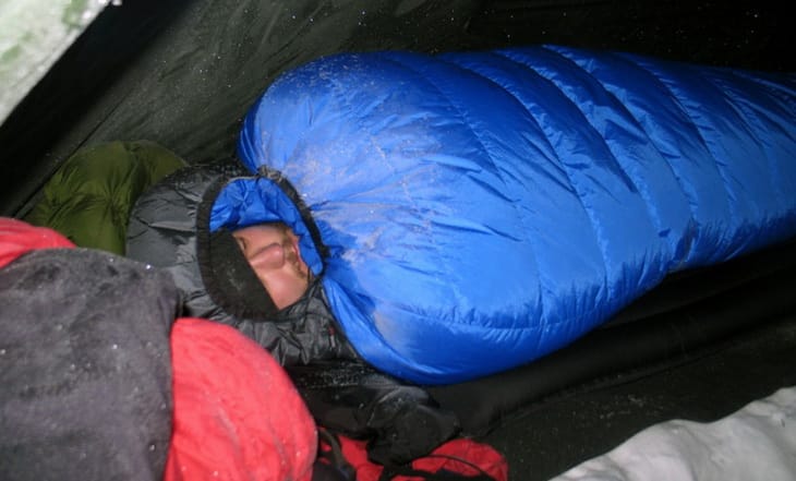 Man sleeping in Close up of Western Mountaineering Puma Gore WS Sleeping Bag