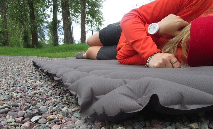 Woman laying down on Klymit-Static-V-Luxe-sleeping pad
