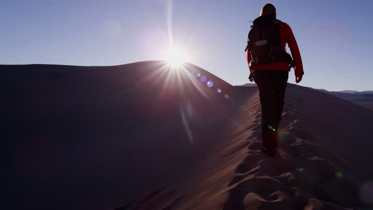 Trekking woman walking success desert