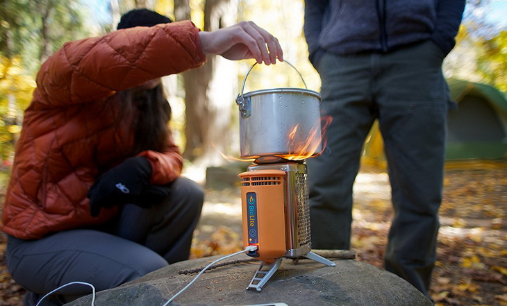 Two persons cooking on Biolite Wood stove