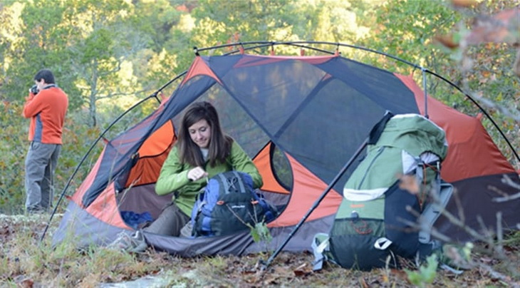 Two person camping in nature with alps mountaineering tent
