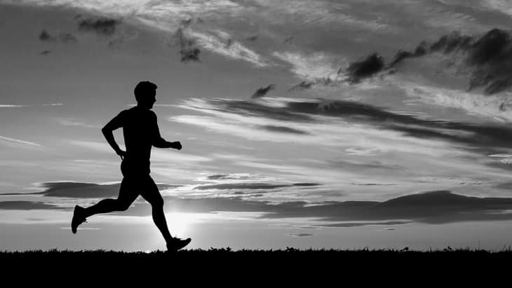 Man running before sunrise