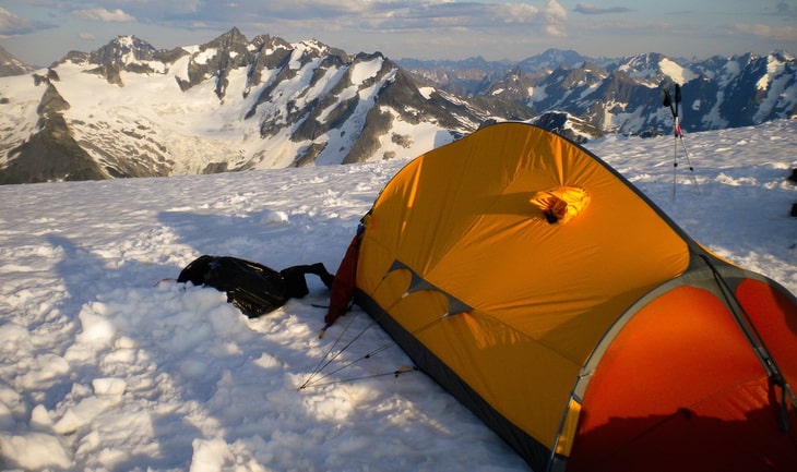 Tent above mountains