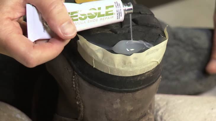 man repairing a boot sole