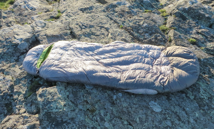 Nemo sleeping bag sitting on a rock outside