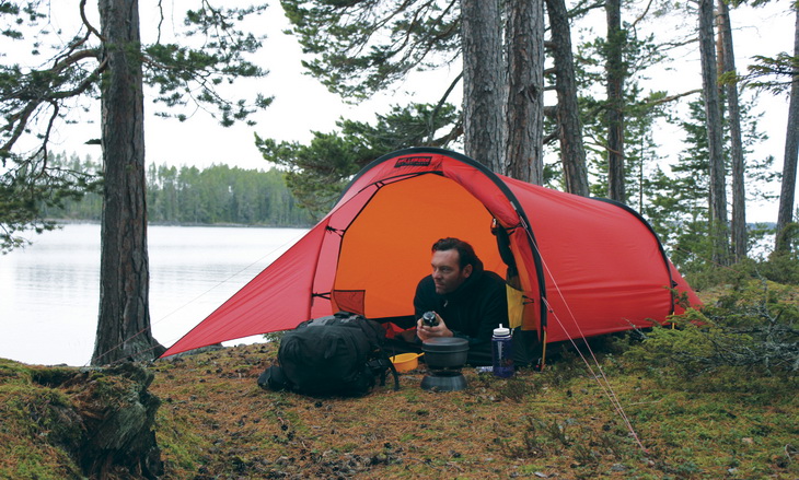 A man relaxing in a Hilleberg Anjan 2 Person Tent
