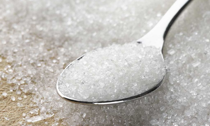 image of sugar in a spoon