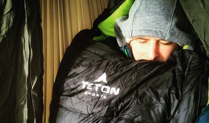 Man sleeping very well in a Teton Sports sleeping bag inside of a tent