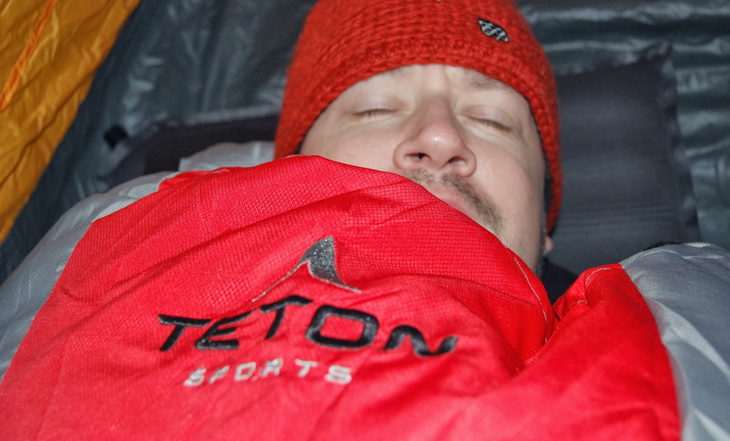 Man sleeping in Teton Sports sleeping bag
