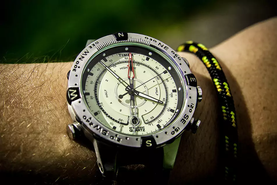 quartz watch on hand with compass