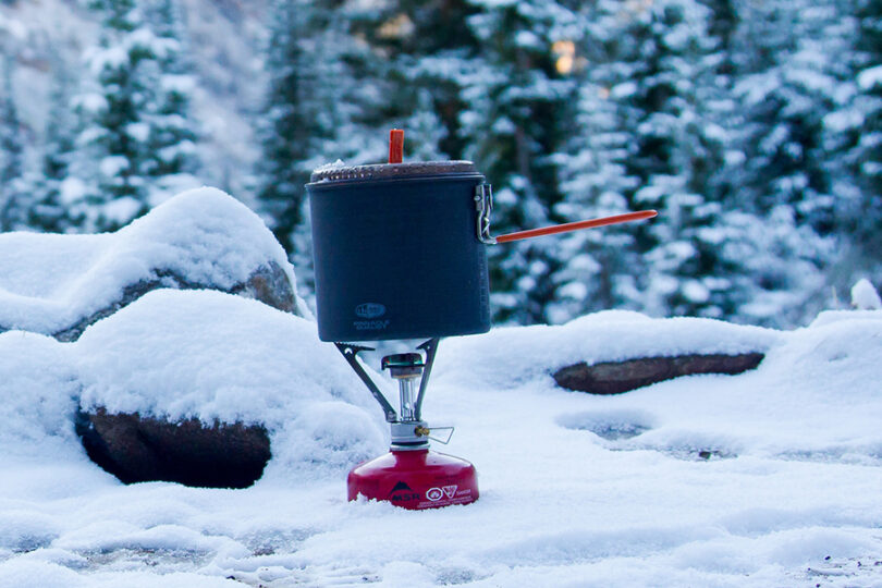 backpacking stove in snow