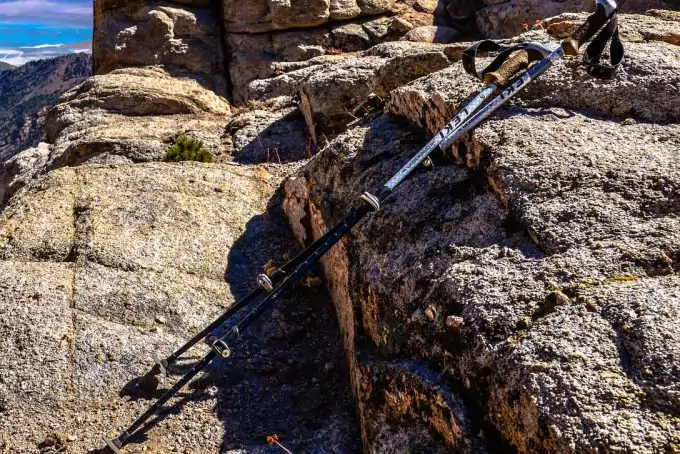 hiking poles put on rock