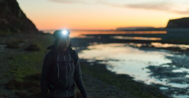 girl wearing headlamp while hiking