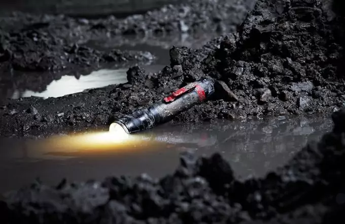 flashlight in mud