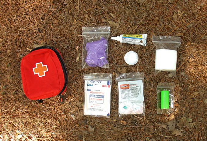 hiking first aid kit on ground