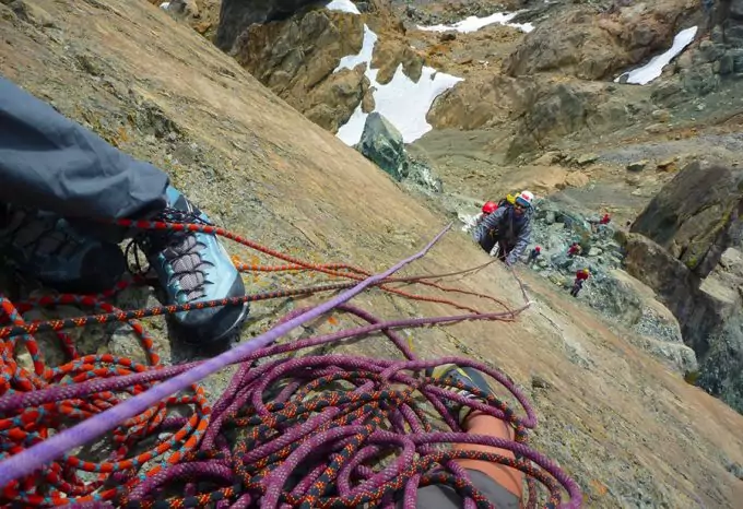 climbers hanging onto ropes