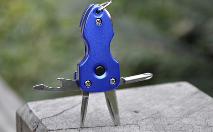 keychain multi tool stuck in wood