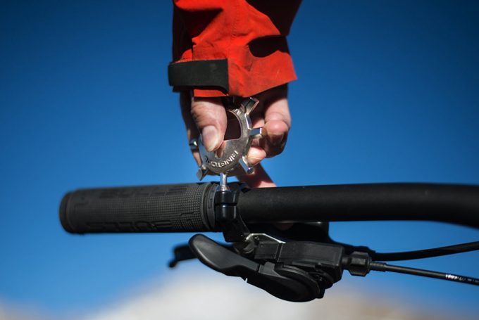 man holding a keychain multi tool in hand