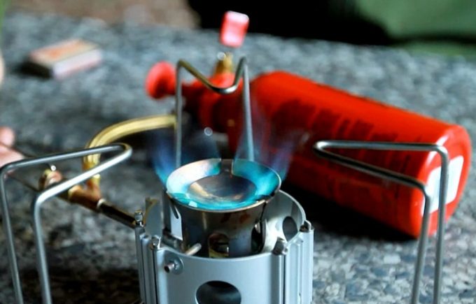 burning backpacking stove with fuel tank 