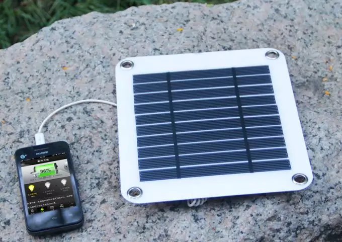 solar panel charging a phone