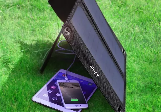 solar charger charging phone and tablet
