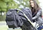Image showing a Bag Nation Diaper Bag Backpack and a woman looking at her child