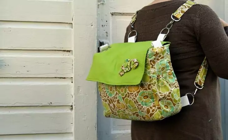 A woman with a convertible-diaper-bag