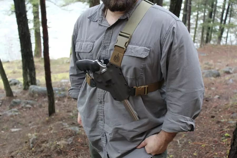 Man hiking with gun