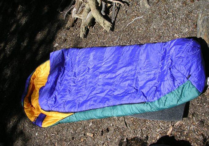 Mummy sleeping bag next to camp fire