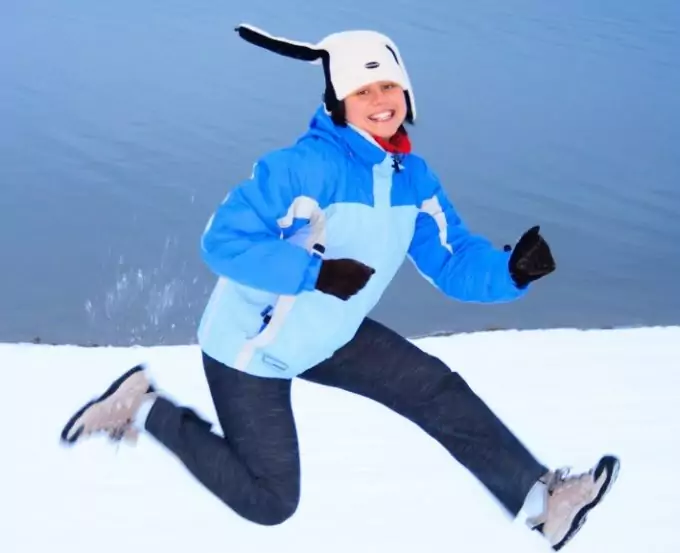 woman jumping on snow